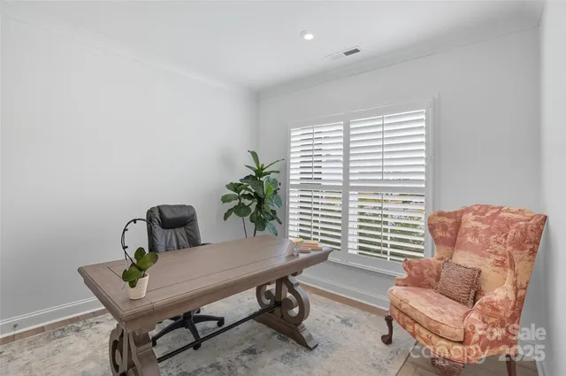 a view of a livingroom with furniture and a window