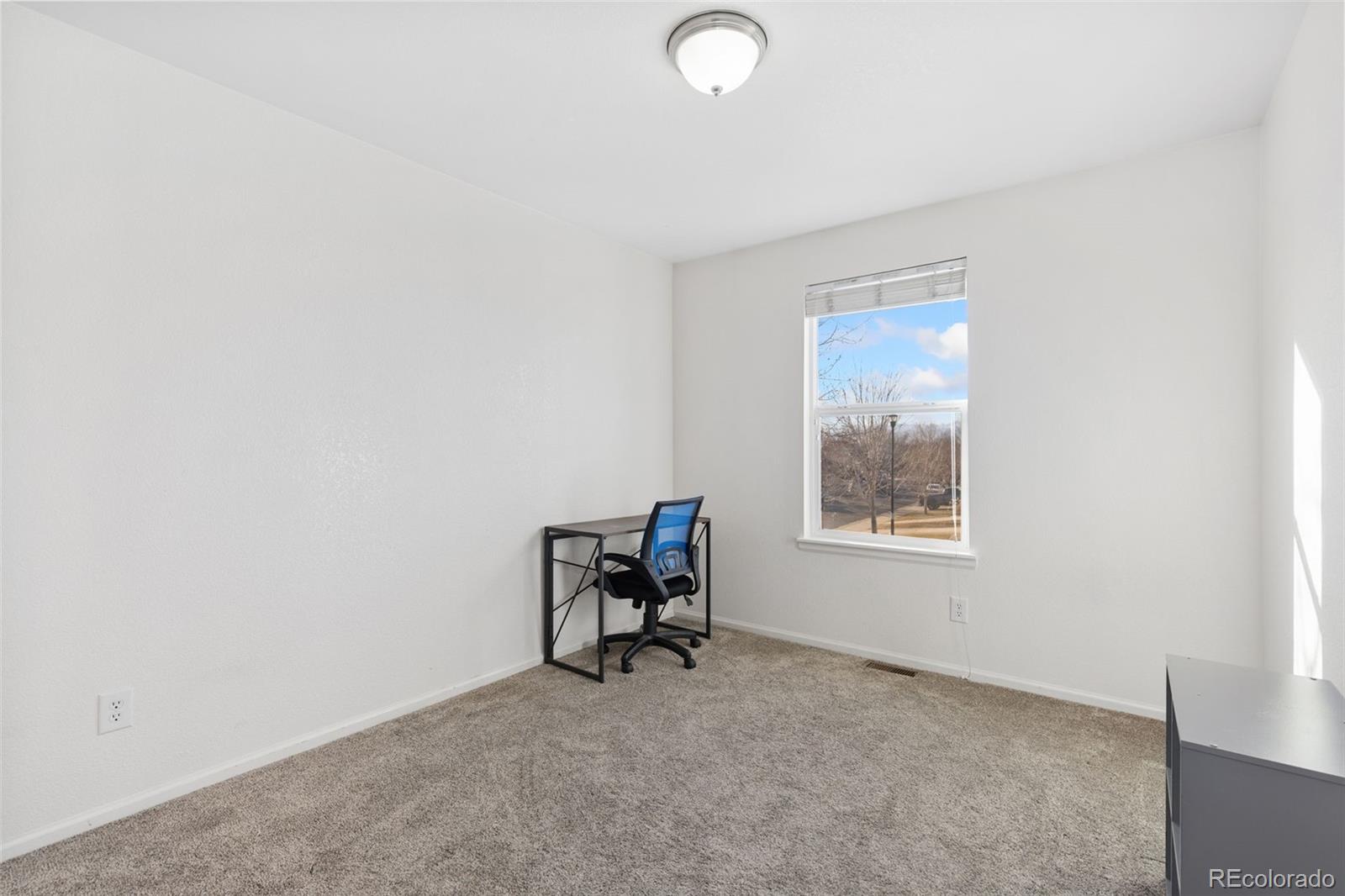 10696 Upper Ridge Road Longmont, CO 80504 - Photo 15 of 25 a room with a chair and a window