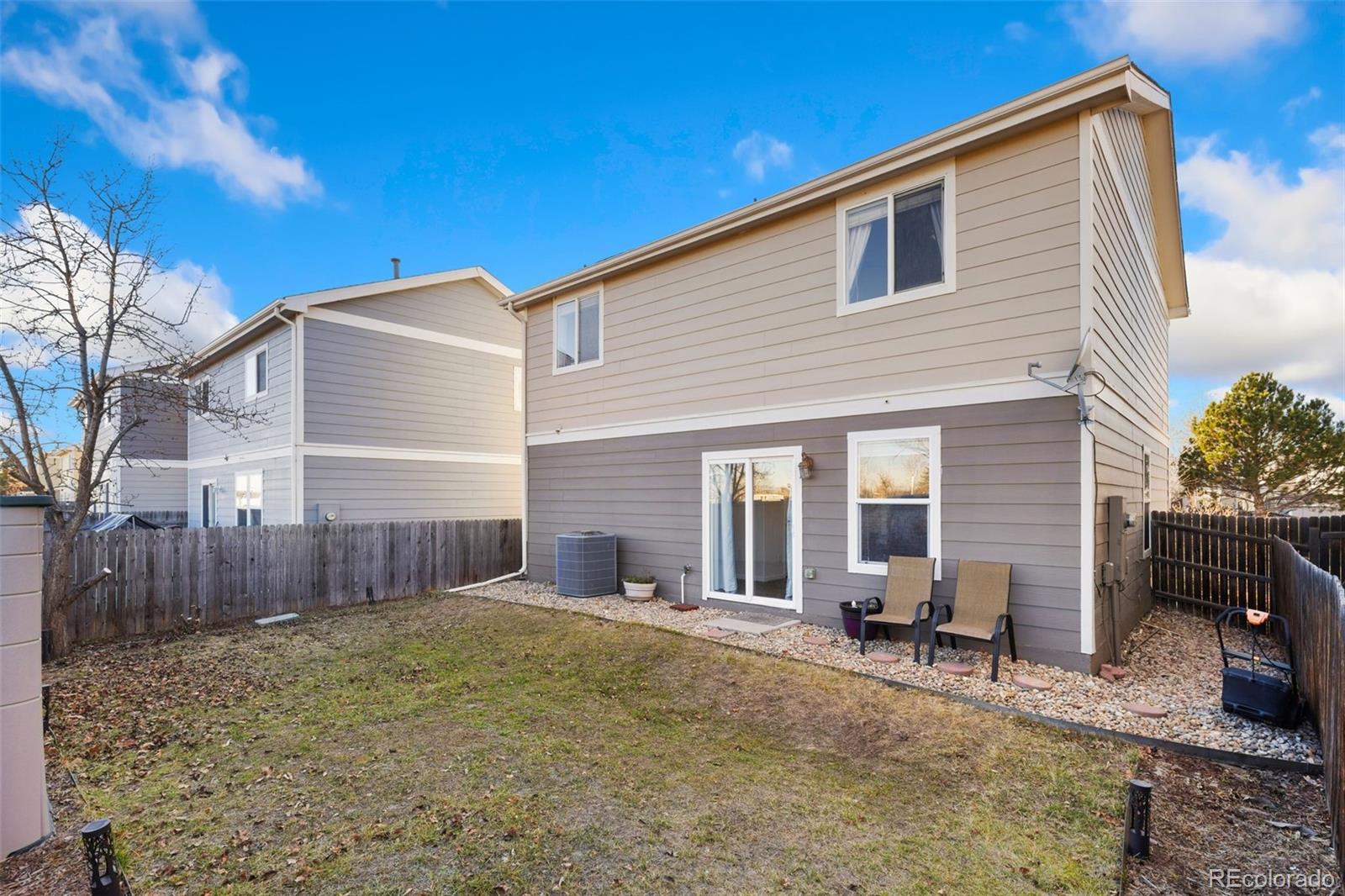 10696 Upper Ridge Road Longmont, CO 80504 - Photo 20 of 25 a view of a house with a backyard