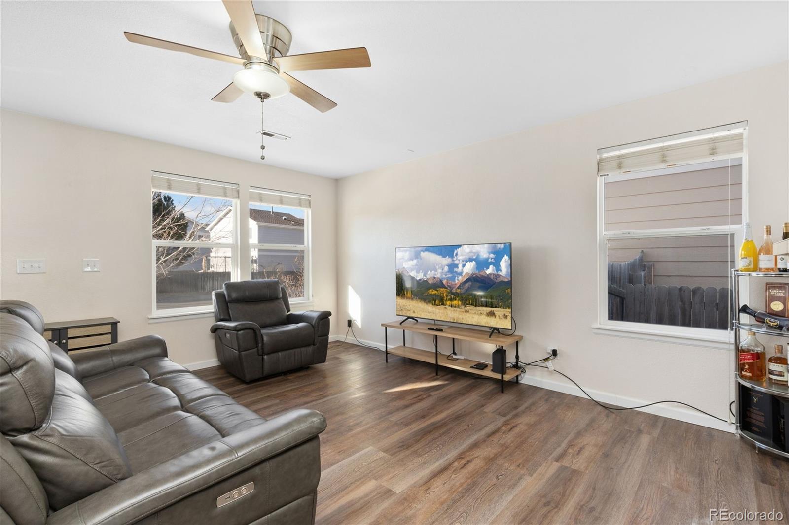 10696 Upper Ridge Road Longmont, CO 80504 - Photo 4 of 25 a living room with furniture and a flat screen tv