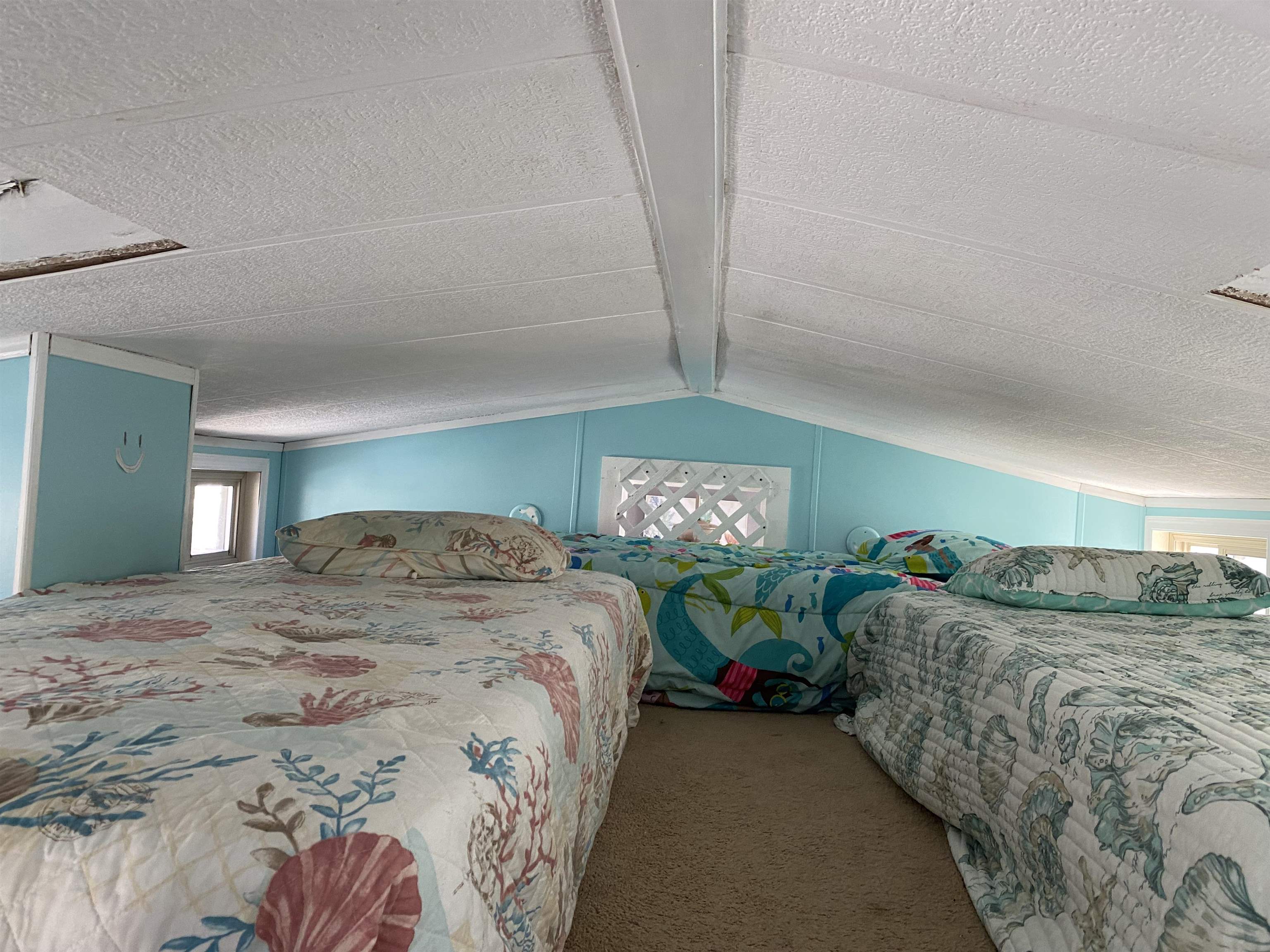 515 Corsons Tavern Road Ocean View, NJ 08230 - Photo 13 of 18 a bed sitting in a bedroom next to a lamp