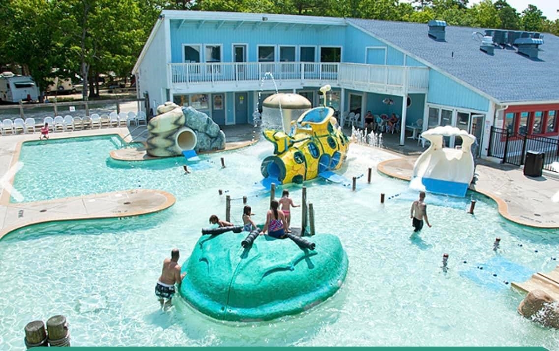 515 Corsons Tavern Road Ocean View, NJ 08230 - Photo 16 of 18 a backyard of a house with table and chairs