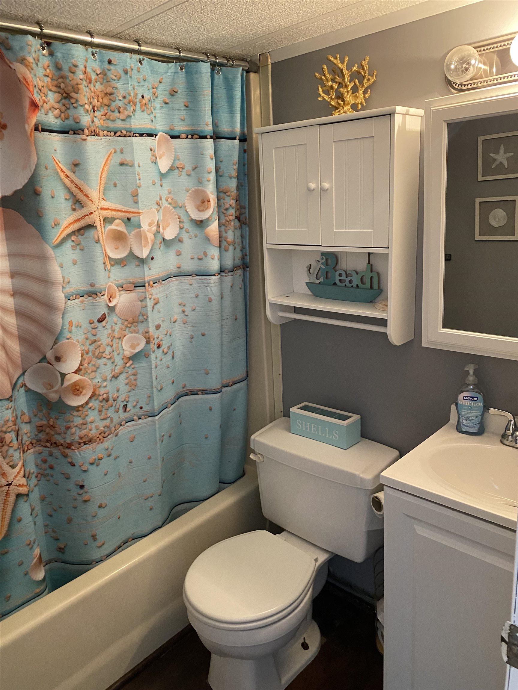 515 Corsons Tavern Road Ocean View, NJ 08230 - Photo 8 of 18 a white toilet sitting next to a bathroom sink