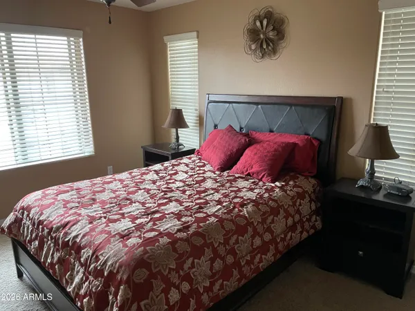 a bedroom with a bed and window