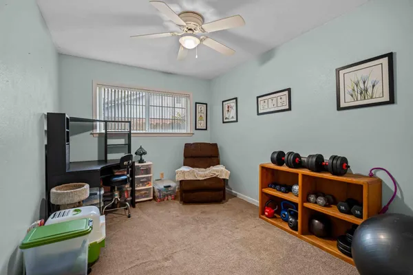 a bedroom with furniture and a window