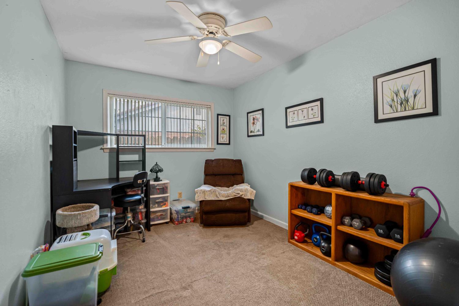 3913 Peacock Lane Modesto, CA 95356 - Photo 14 of 21 a bedroom with furniture and a window