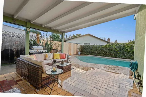 a outdoor living space with furniture and garden view