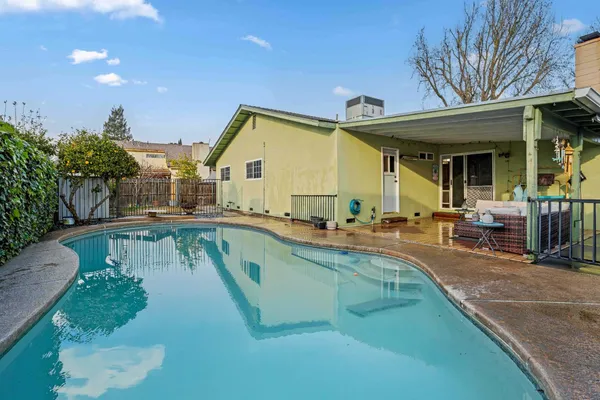 a view of a house with swimming pool