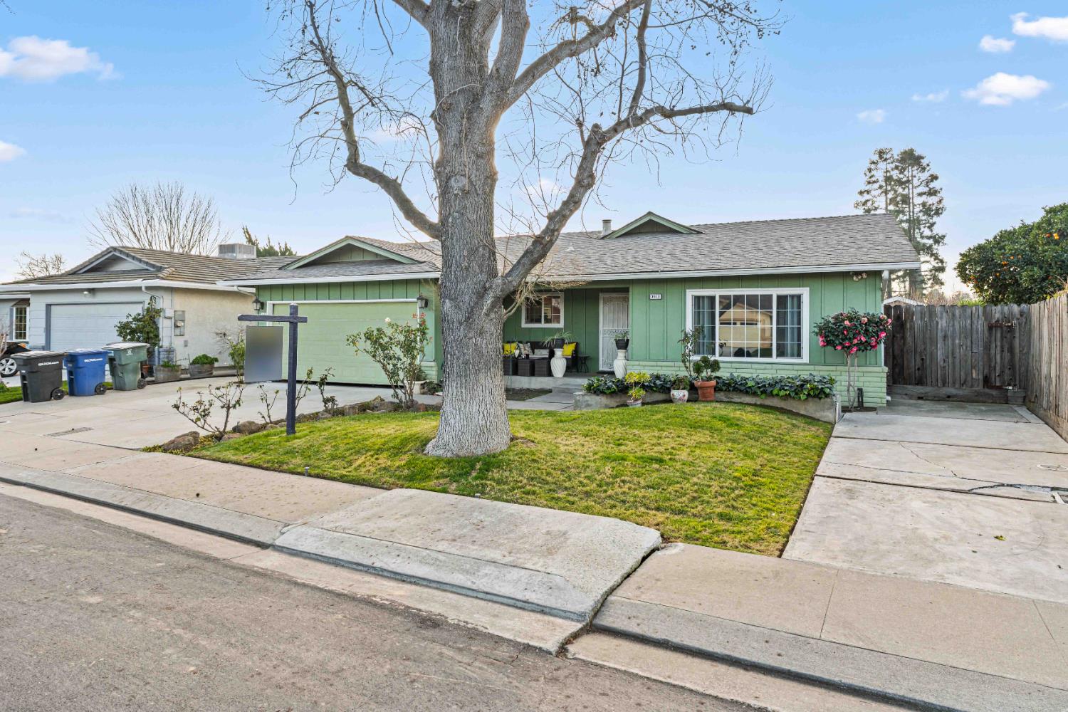 3913 Peacock Lane Modesto, CA 95356 - Photo 3 of 21 a front view of house with yard and green space