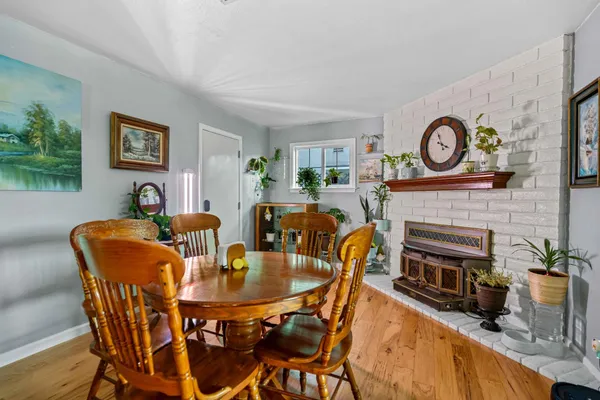 a dining room with furniture and a fireplace