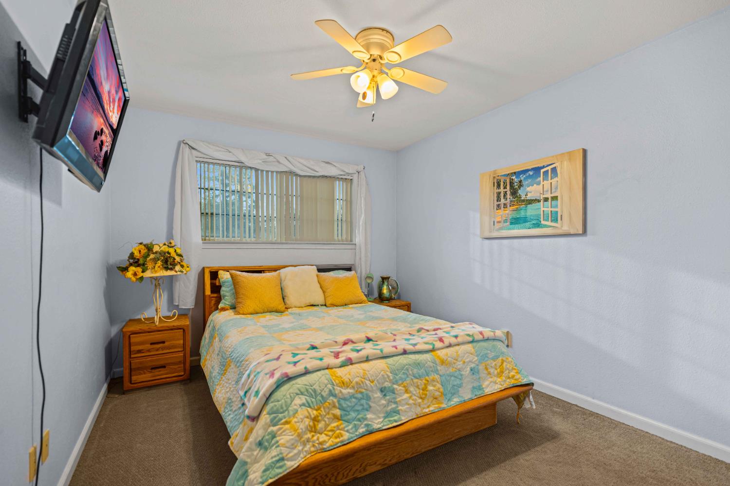 3913 Peacock Lane Modesto, CA 95356 - Photo 8 of 21 a bedroom with a bed and a chandelier