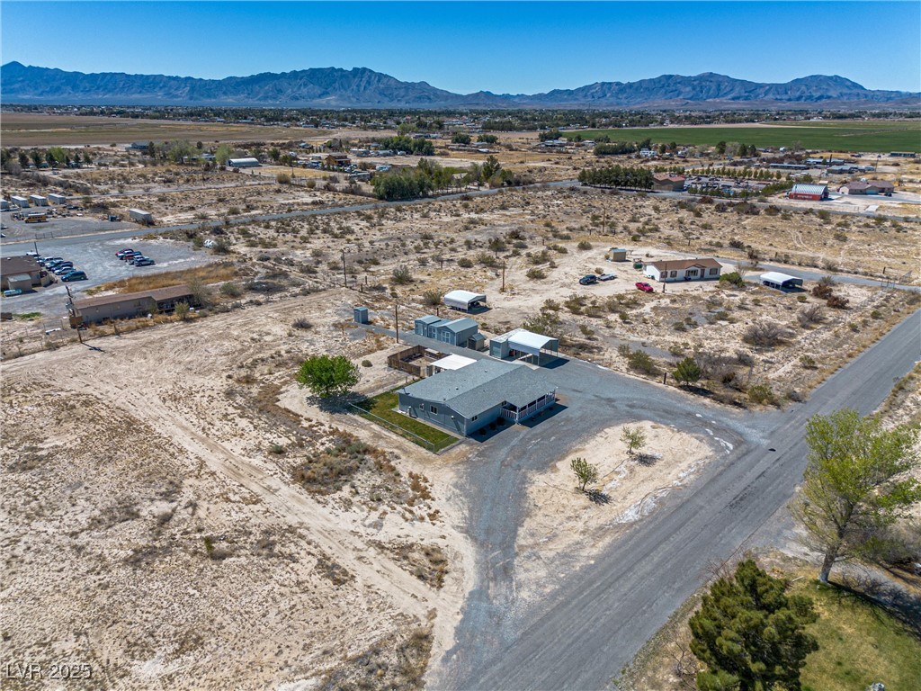101 West Pechstein Road Pahrump, NV 89060 - Photo 32 of 33 Birds eye view of property featuring a mountain view and a rural view