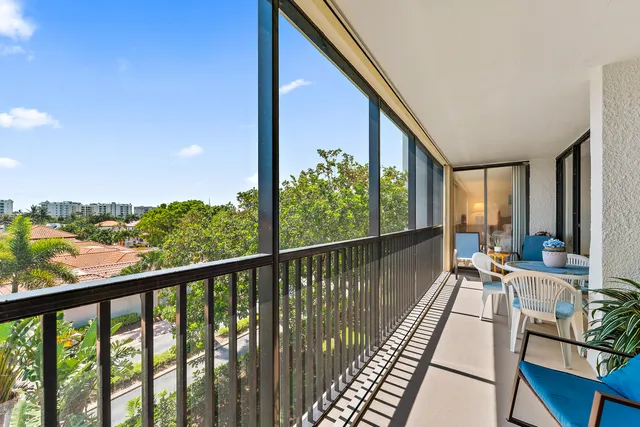 a view of balcony with furniture
