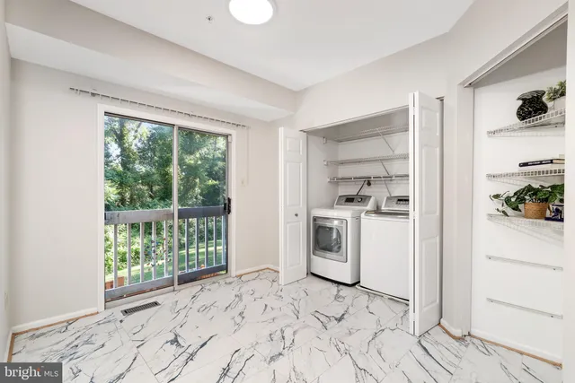 a view of a kitchen with a stove top oven and cabinets