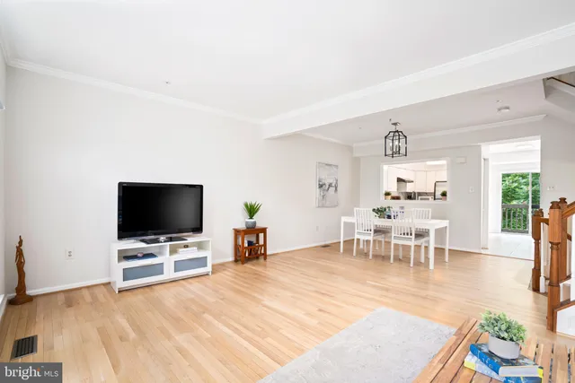 a view of a livingroom with furniture and a flat screen tv