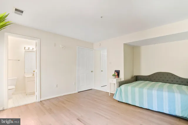 a bedroom with a bed and a closet