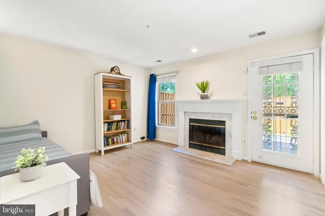 a living room with furniture and a fireplace