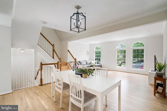 a view of a livingroom with furniture wooden floor and windows