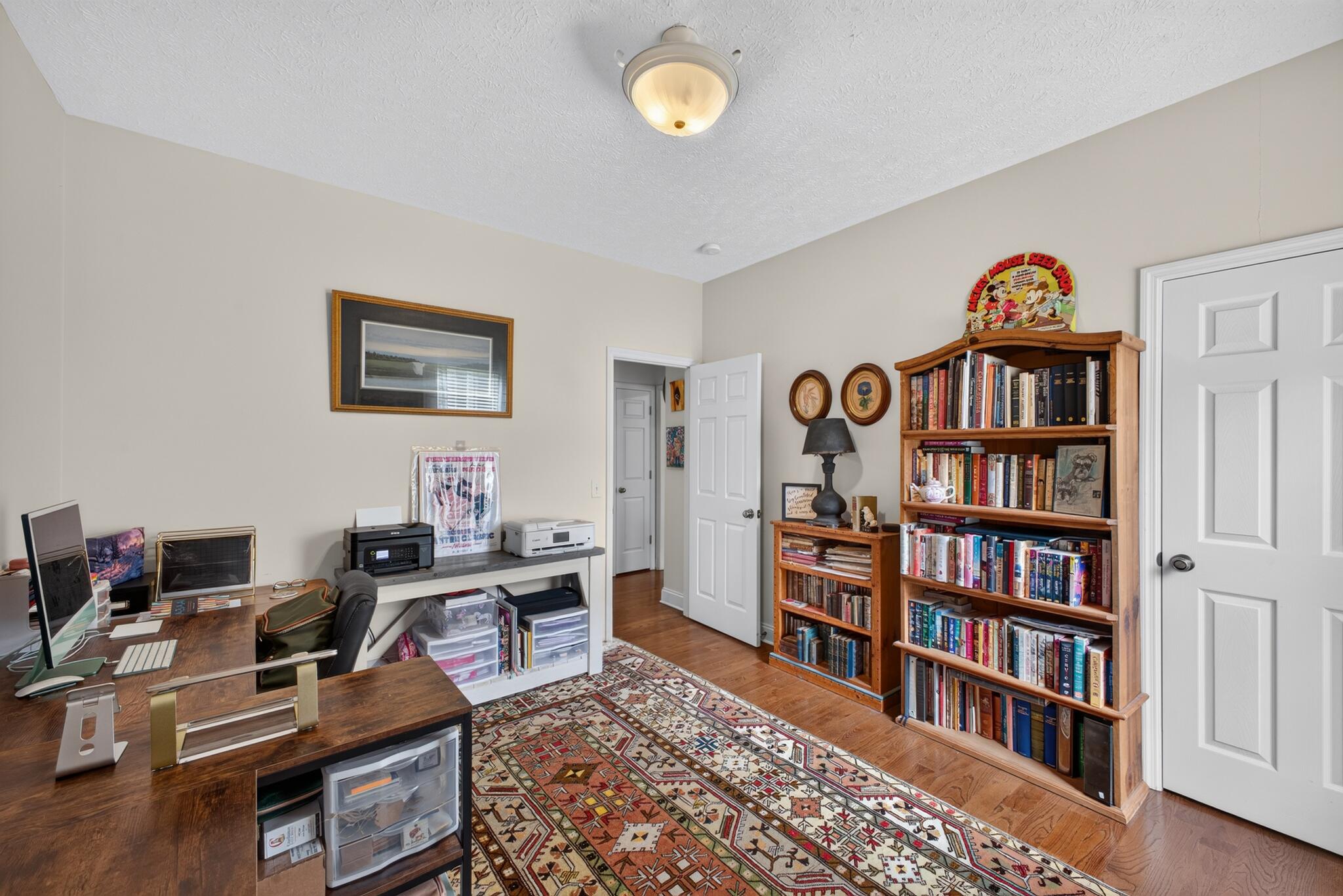 42 Emerald Ridge Aiken, SC 29803 - Photo 13 of 33 a view of a workspace with furniture and a book shelf