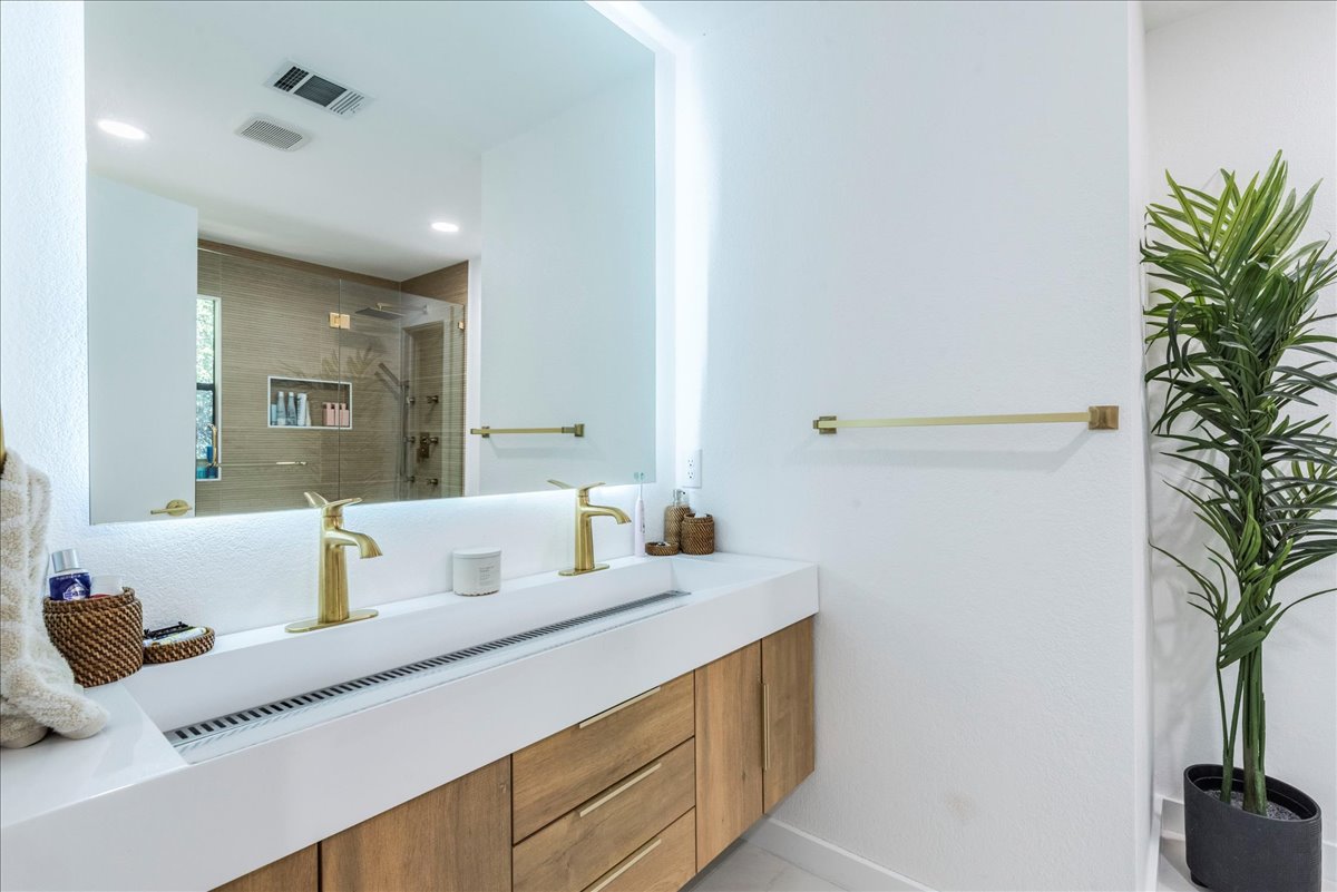 1707 Yucca Lane Cedar Park, TX 78613 - Photo 15 of 26 a bathroom with a sink and a mirror