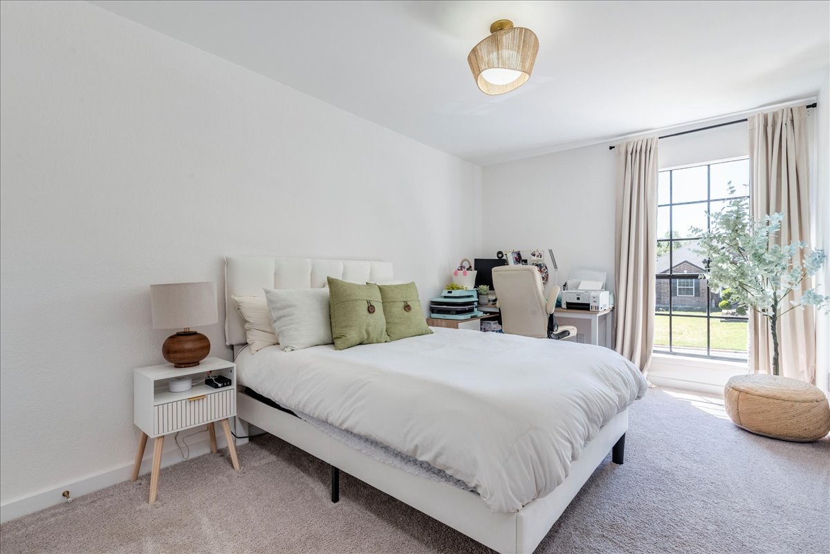 1707 Yucca Lane Cedar Park, TX 78613 - Photo 17 of 26 a bedroom with a bed and a chair