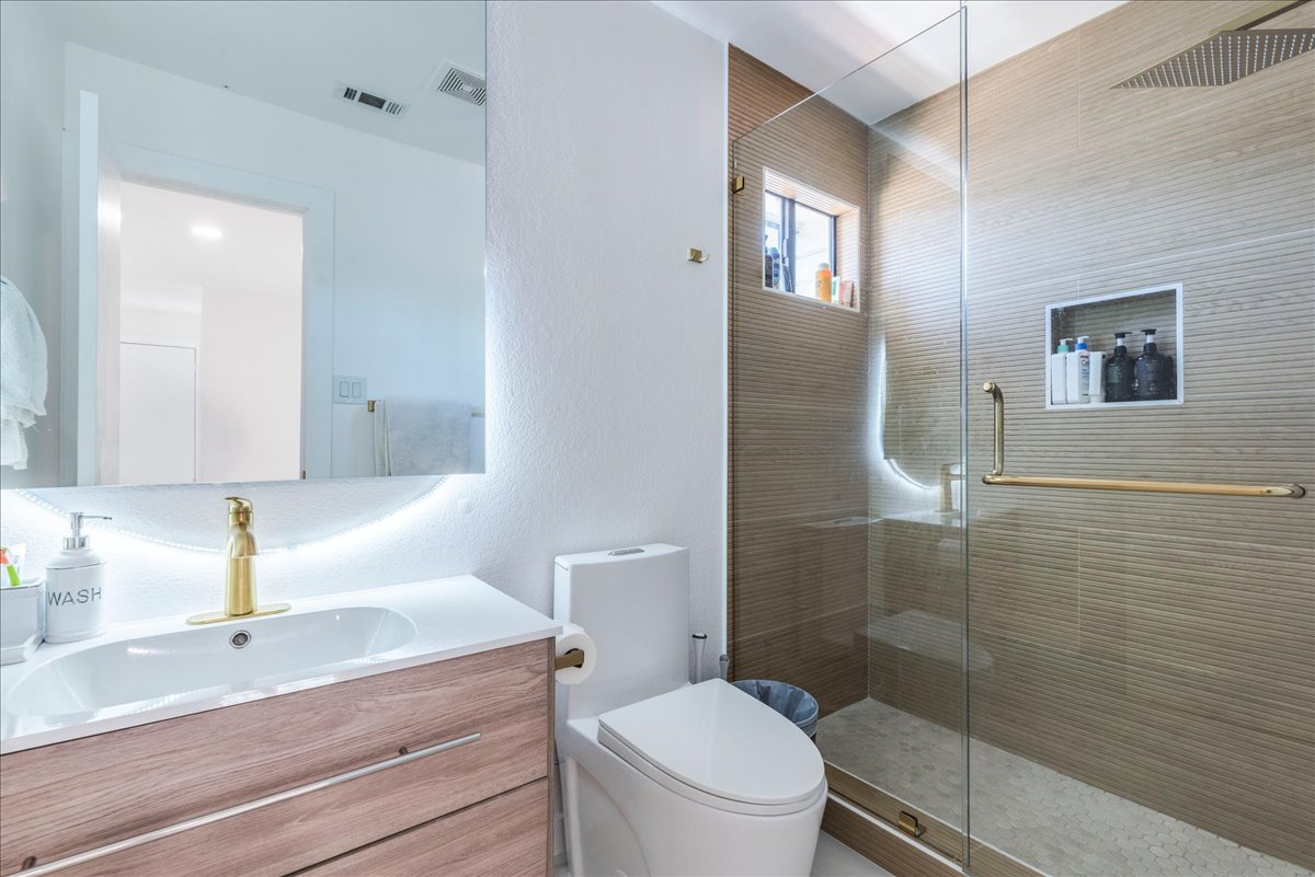 1707 Yucca Lane Cedar Park, TX 78613 - Photo 20 of 26 a bathroom with a sink a toilet and shower