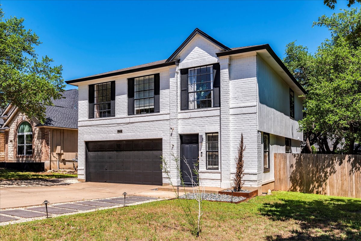 1707 Yucca Lane Cedar Park, TX 78613 - Photo 25 of 26 a front view of a house with a yard