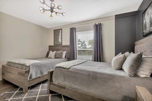 a bedroom with a bed and window