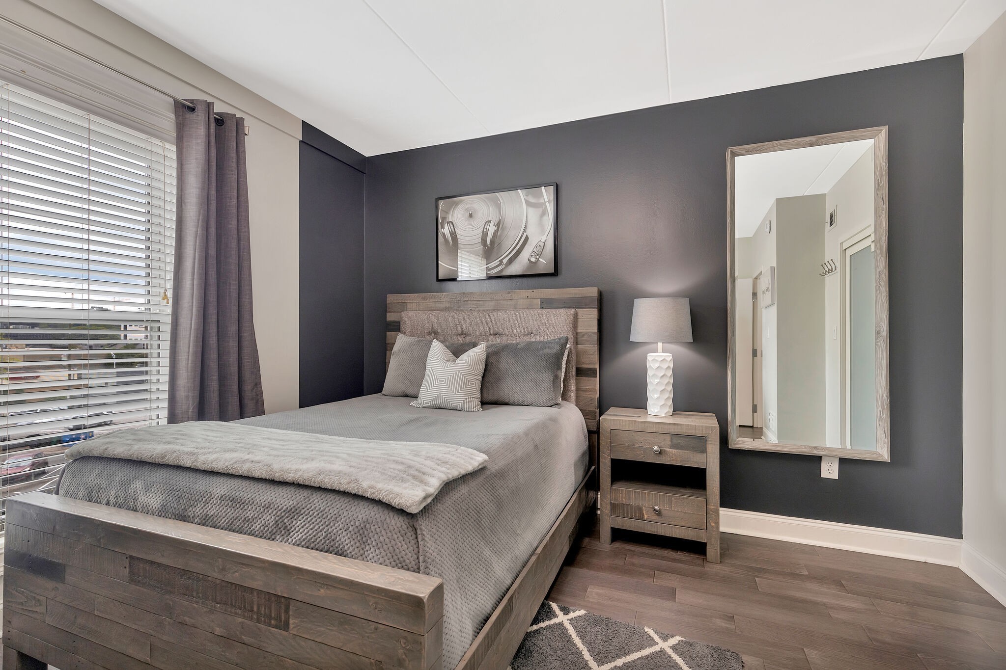 11 Music Square East, Unit 203 Nashville, TN 37203 - Photo 14 of 26 a bedroom with a bed and a window