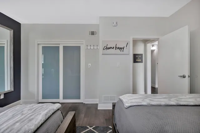 a bedroom with a granite countertop bed and a window