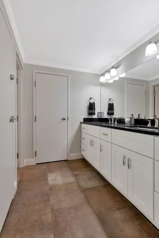 a kitchen with white cabinets