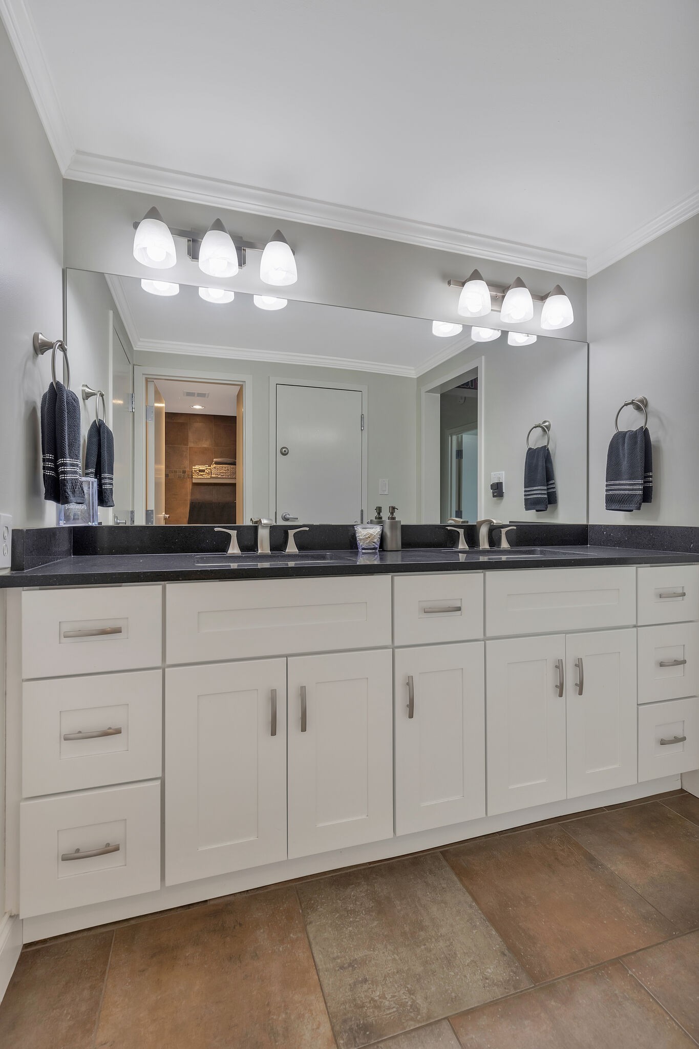 11 Music Square East, Unit 203 Nashville, TN 37203 - Photo 17 of 26 a bathroom with a sink mirror and cabinets