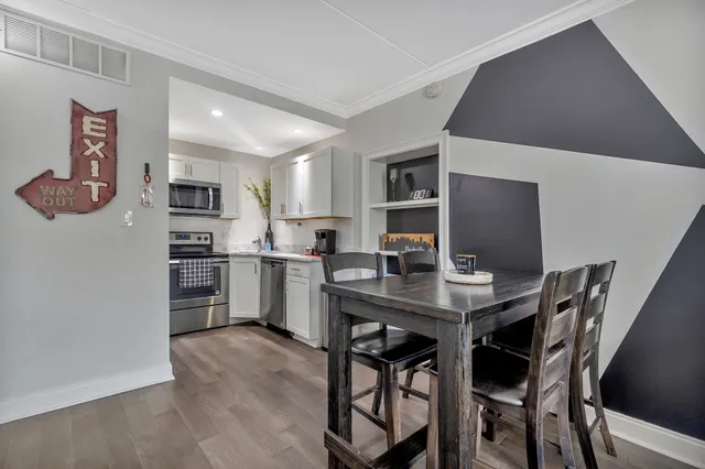 a kitchen with a table and chairs in it