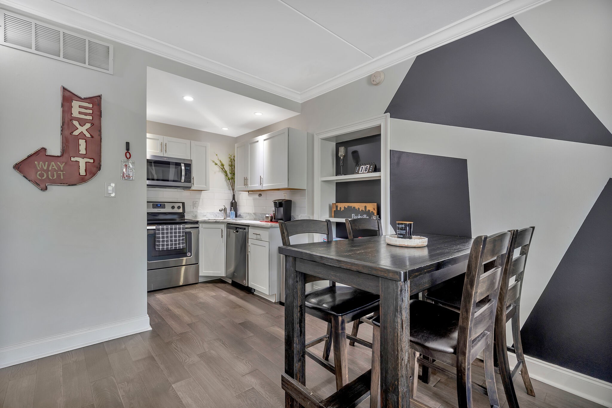 11 Music Square East, Unit 203 Nashville, TN 37203 - Photo 3 of 26 a kitchen with a table and chairs in it