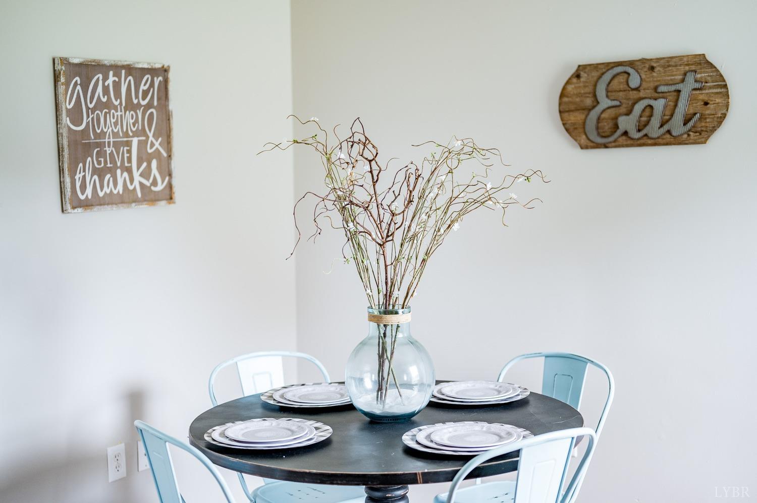 1164 English Tavern Road Rustburg, VA 24588 - Photo 12 of 46 a view of a dining room with furniture and wooden floor