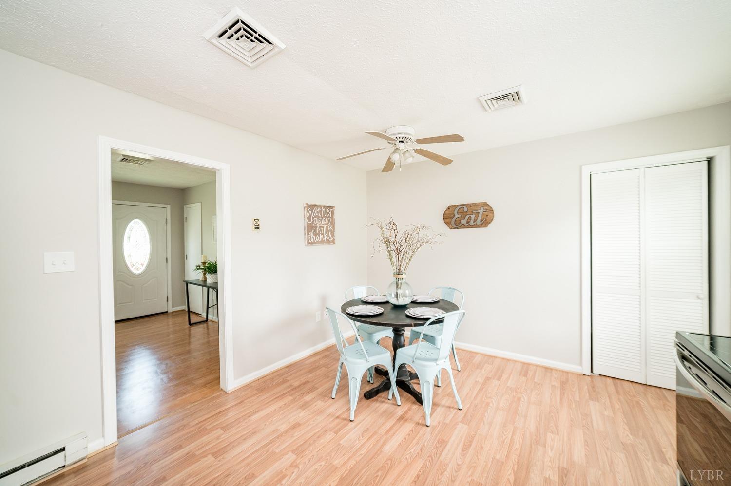 1164 English Tavern Road Rustburg, VA 24588 - Photo 14 of 46 a view of a room with wooden floor table and chairs