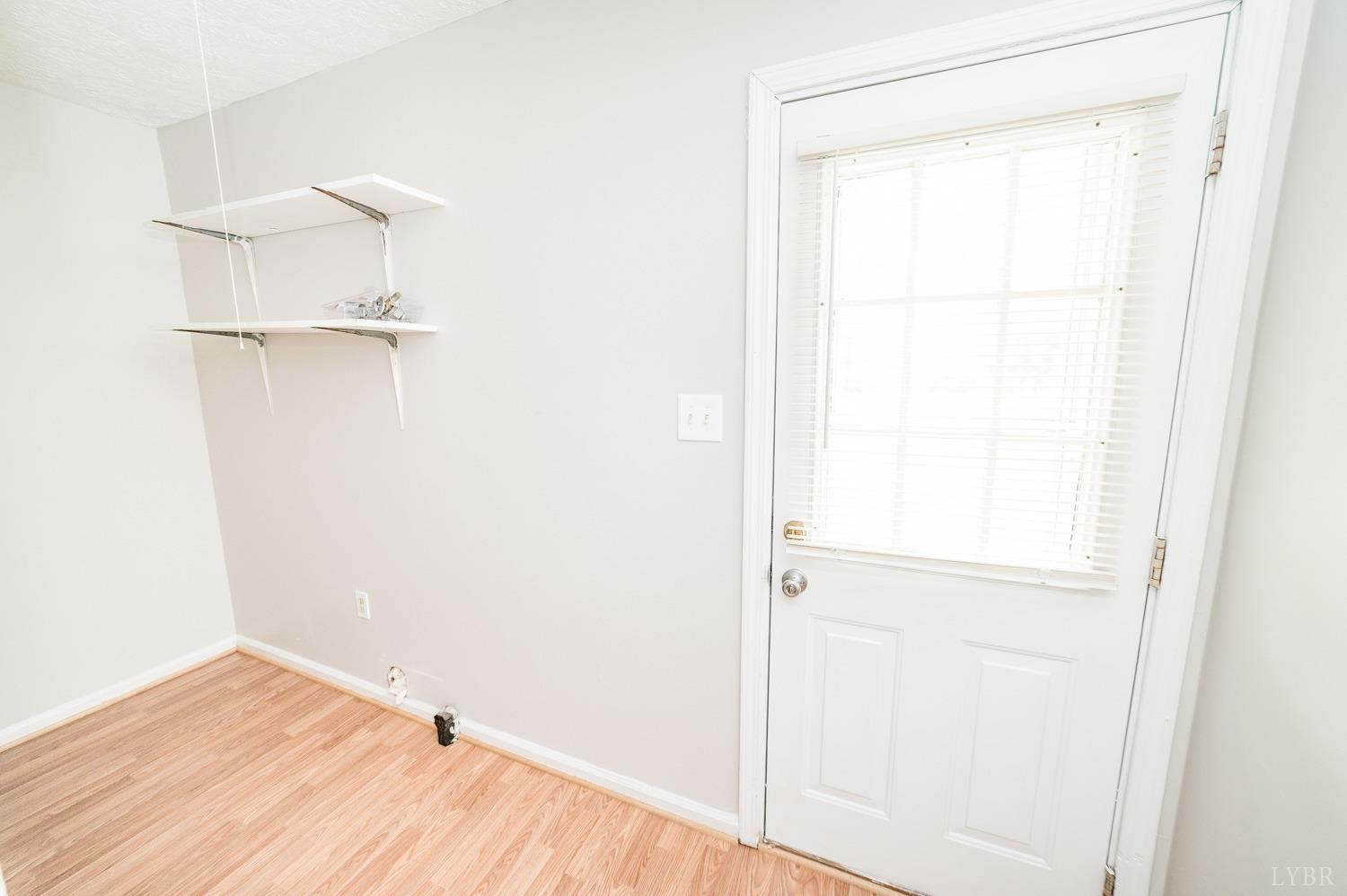 1164 English Tavern Road Rustburg, VA 24588 - Photo 21 of 46 a view of an empty room with wooden floor