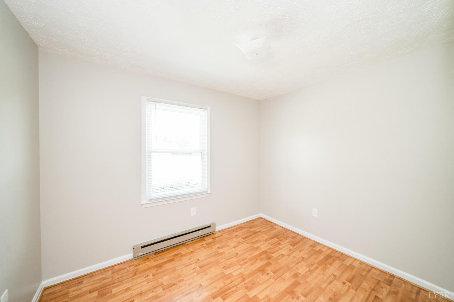 1164 English Tavern Road Rustburg, VA 24588 - Photo 22 of 46 an empty room with a window
