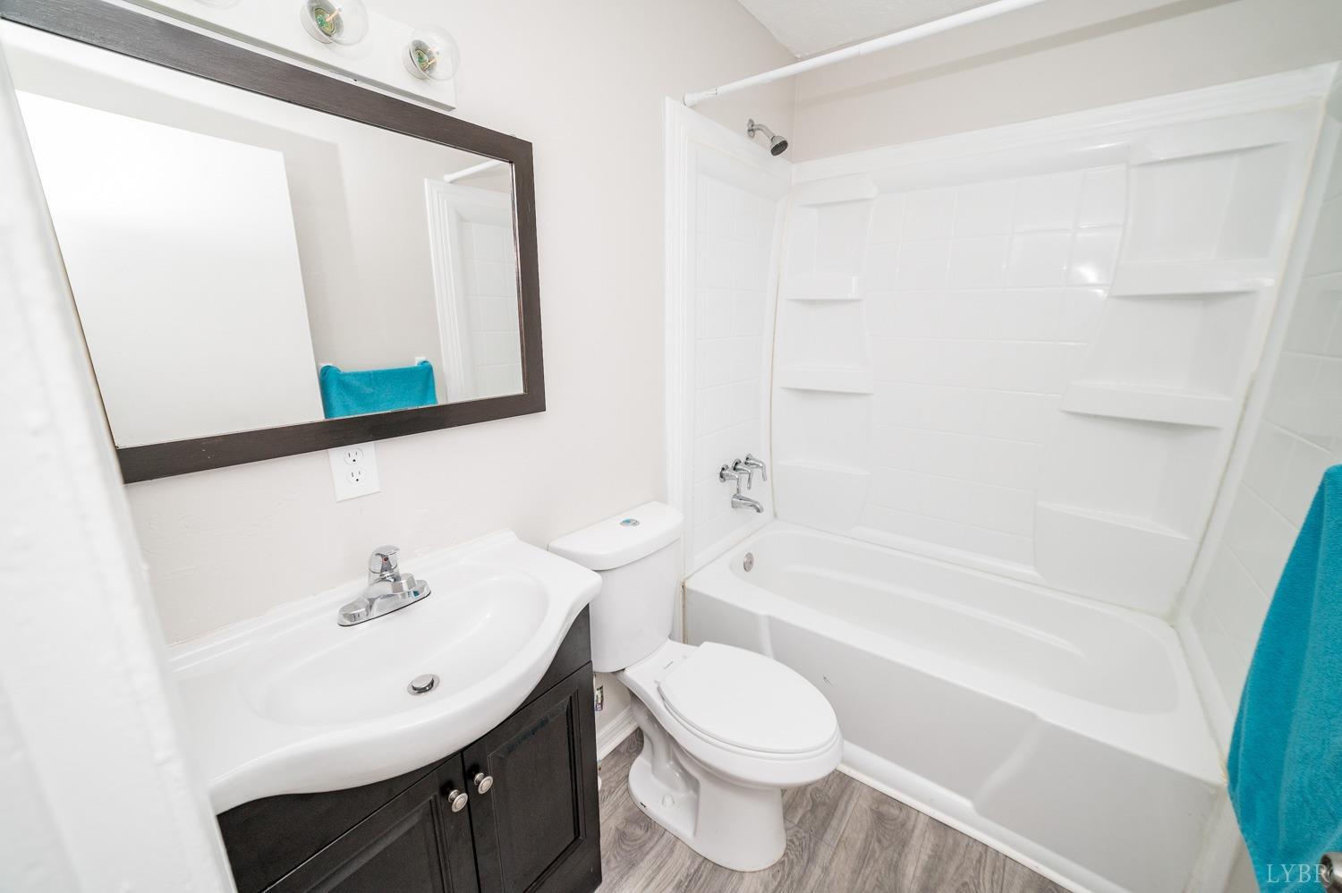 1164 English Tavern Road Rustburg, VA 24588 - Photo 24 of 46 a bathroom with a sink a toilet and shower