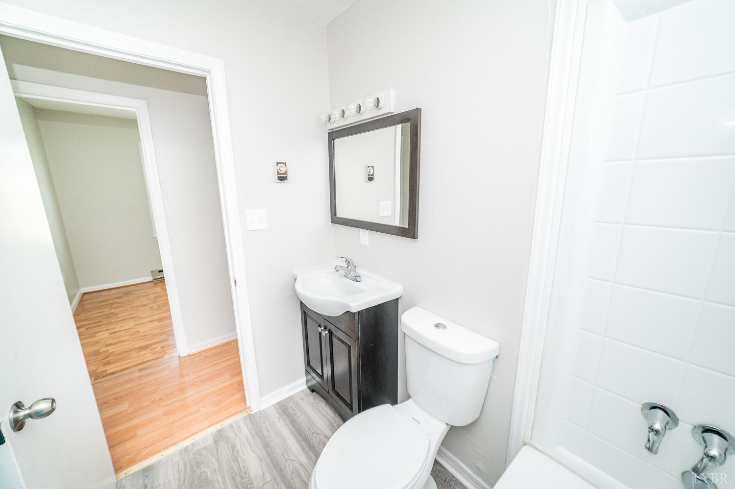 1164 English Tavern Road Rustburg, VA 24588 - Photo 25 of 46 a white toilet sitting next to a bathroom sink