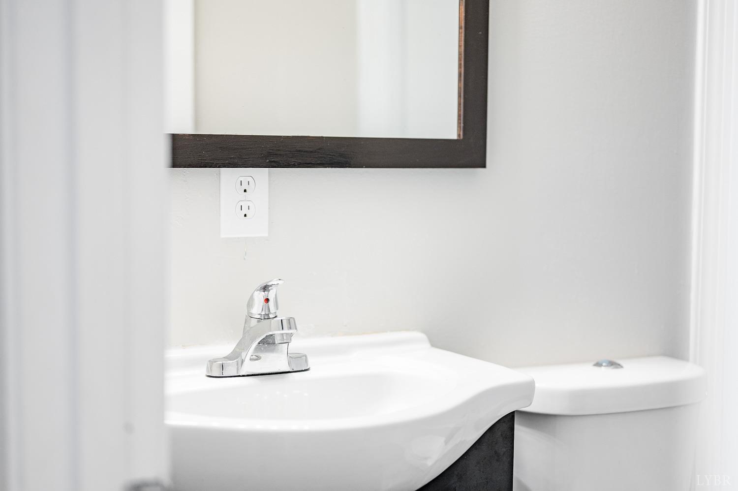 1164 English Tavern Road Rustburg, VA 24588 - Photo 26 of 46 a bathroom with a sink and a mirror