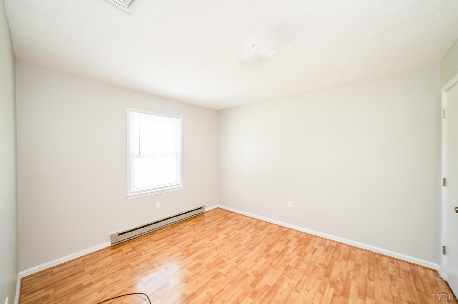 1164 English Tavern Road Rustburg, VA 24588 - Photo 27 of 46 a view of empty room with wooden floor