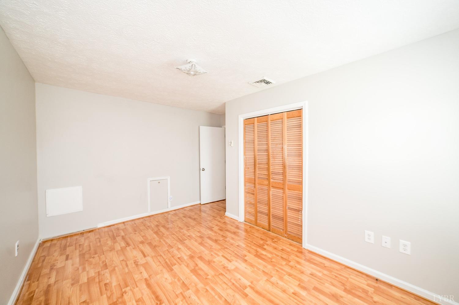1164 English Tavern Road Rustburg, VA 24588 - Photo 30 of 46 a bedroom with a bed and a window