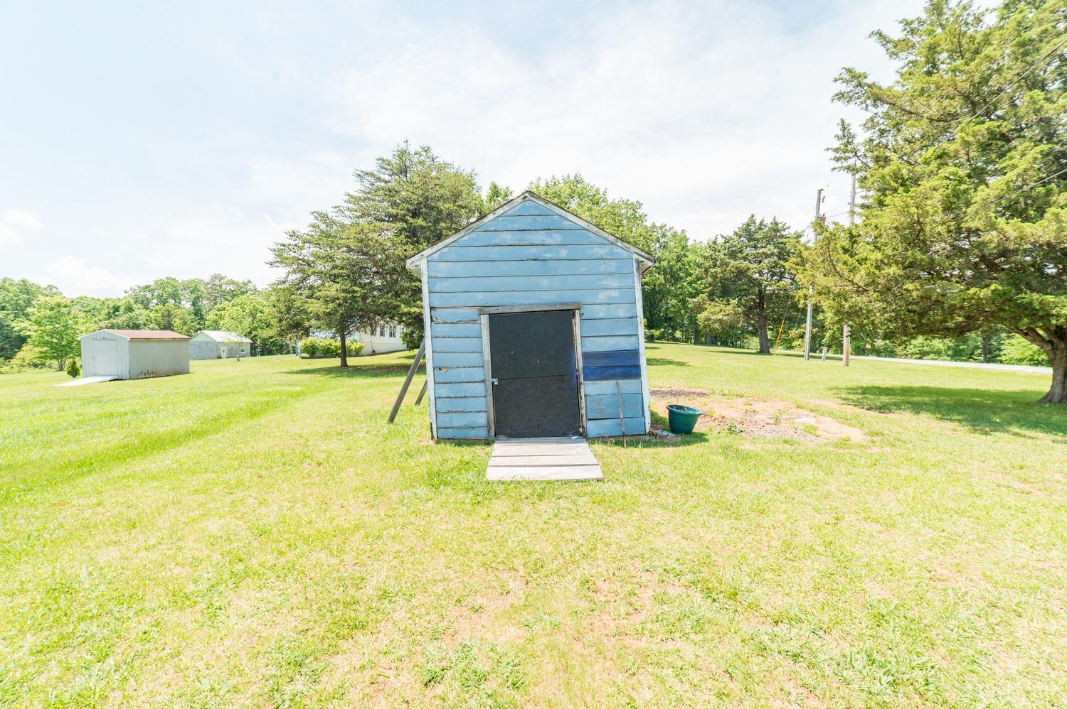 1164 English Tavern Road Rustburg, VA 24588 - Photo 39 of 46 a big room with yard and a large tree