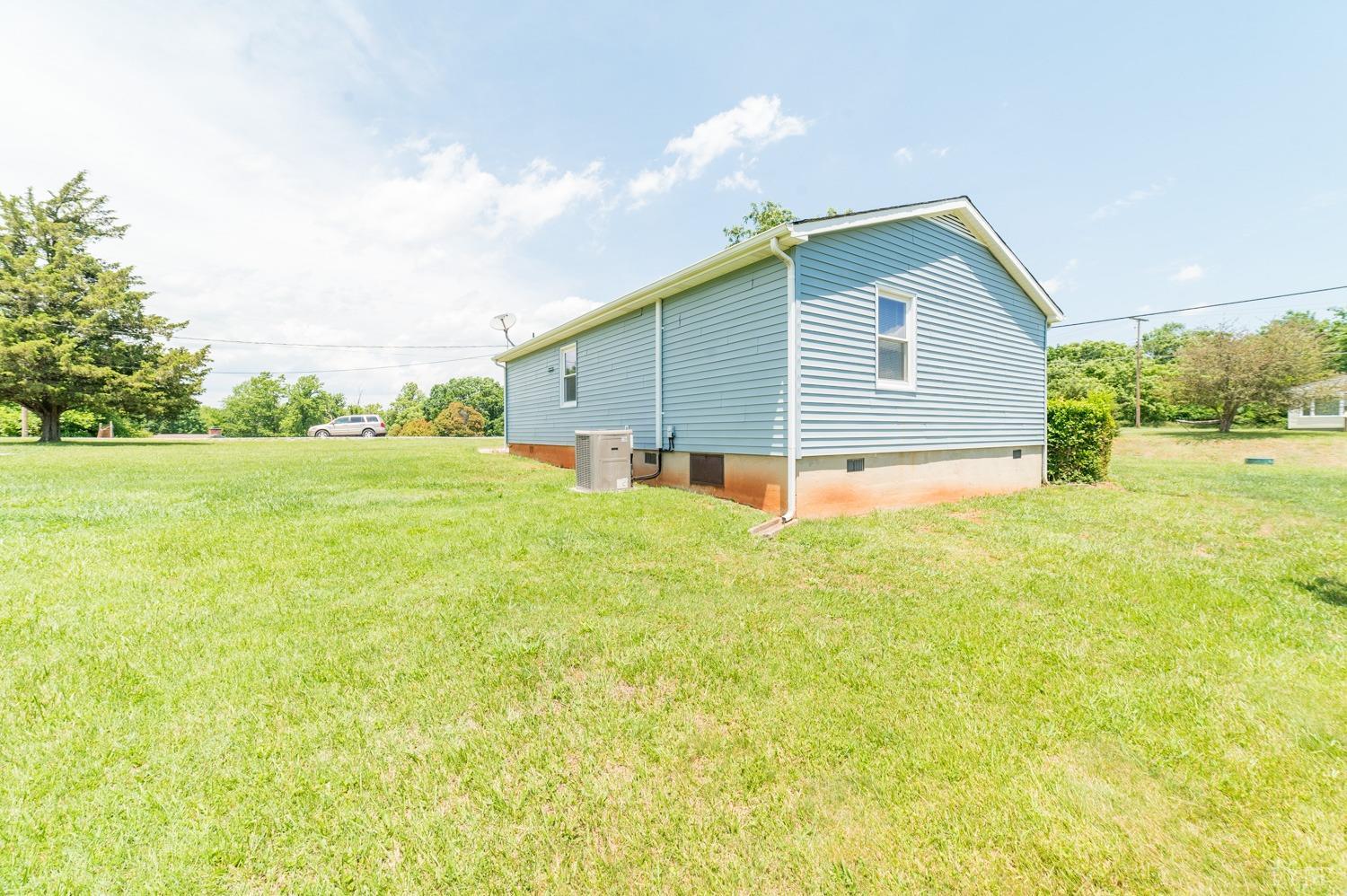 1164 English Tavern Road Rustburg, VA 24588 - Photo 41 of 46 a view of an house with backyard and garden