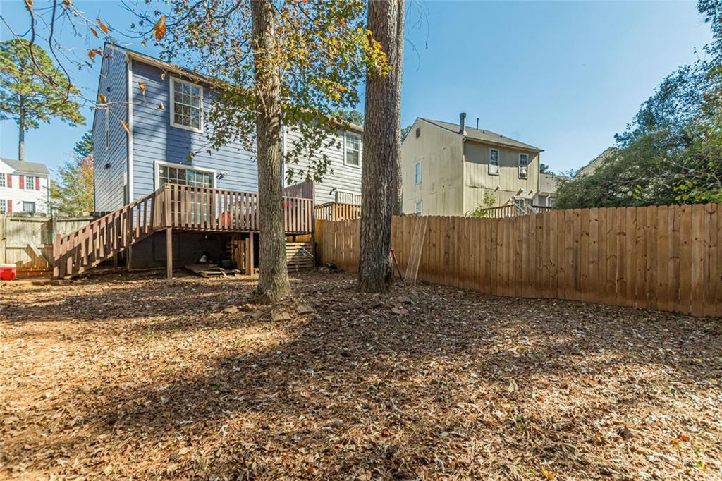 3477 Kingswood Trail Decatur, GA 30034 - Photo 12 of 44 a view of a house with a yard and wooden fence