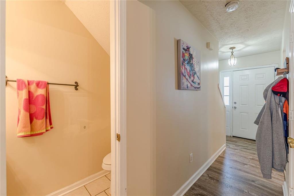 3477 Kingswood Trail Decatur, GA 30034 - Photo 31 of 44 a view of a hallway with paintings on the wall