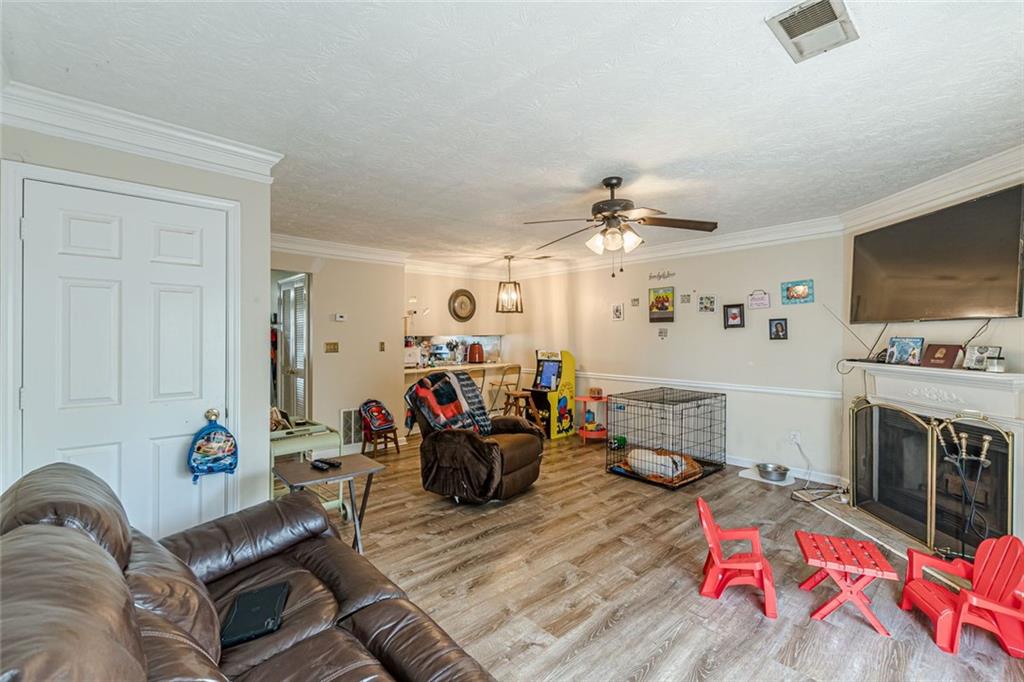 3477 Kingswood Trail Decatur, GA 30034 - Photo 35 of 44 a living room with furniture and a flat screen tv