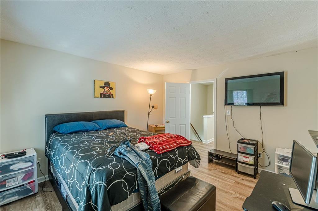 3477 Kingswood Trail Decatur, GA 30034 - Photo 37 of 44 a bedroom with a bed and a flat screen tv