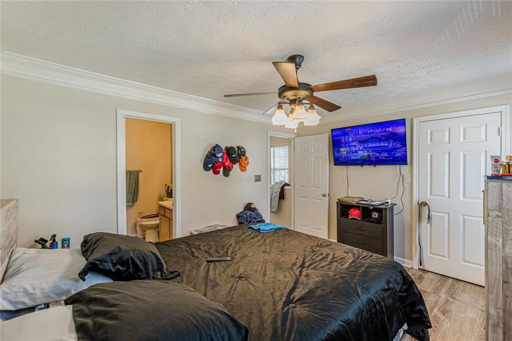 3477 Kingswood Trail Decatur, GA 30034 - Photo 41 of 44 a bedroom with a bed and a chandelier